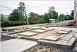 Show image 'Foundations for IHI panels to house the compressor building adjacent to the batching plant. To the right will be the location of the concrete recycling plant.' in New Window