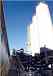 Show image 'The three (200 Tons each) cement silos while being erected on-site. The 85-ft.-high silos provide cement to the two shaft mixers.' in New Window